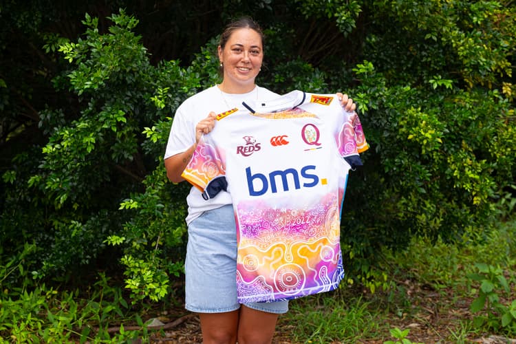 Jersey designer Madi Schuck proudly shows off the new Reds Indigenous jersey from Canterbury