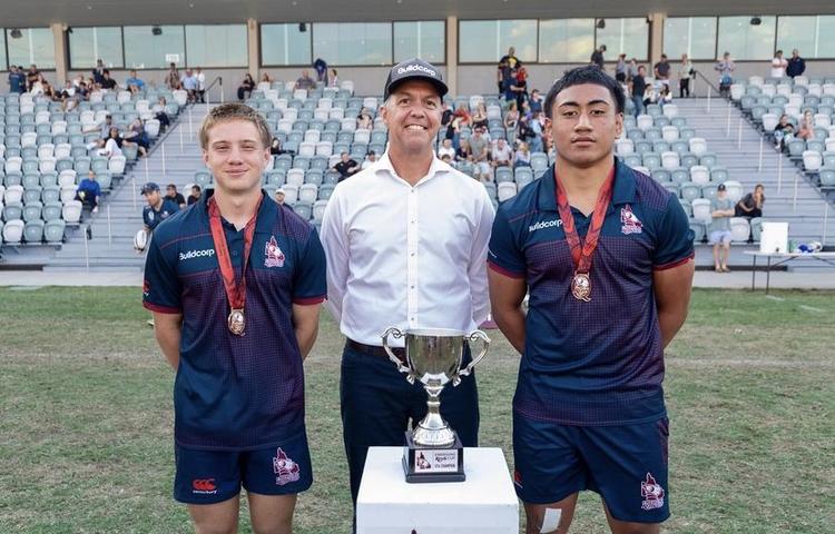 Dylan Terblanche (left) and Agapetos Lote-Felo (right) awarded their Player of the Tournament medals by Buildcorp chief Mike Currie at the Emerging Reds Cup