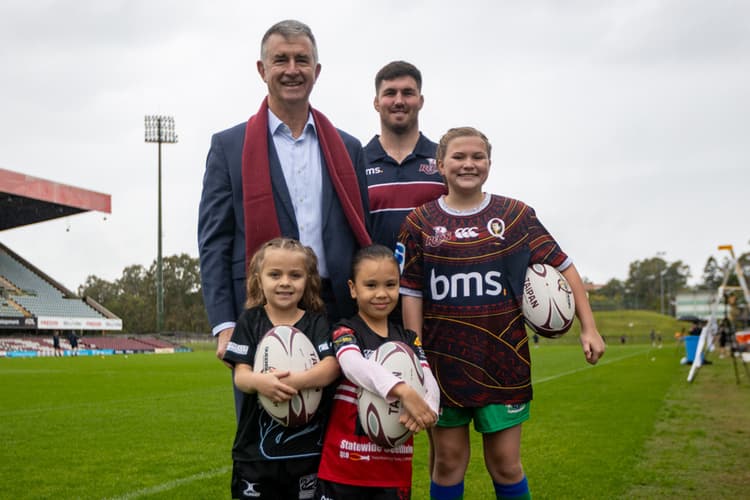 Sports Minister Tim Mander and Reds co-captain Liam Wright with up-and-coming juniors at Ballymore today. 