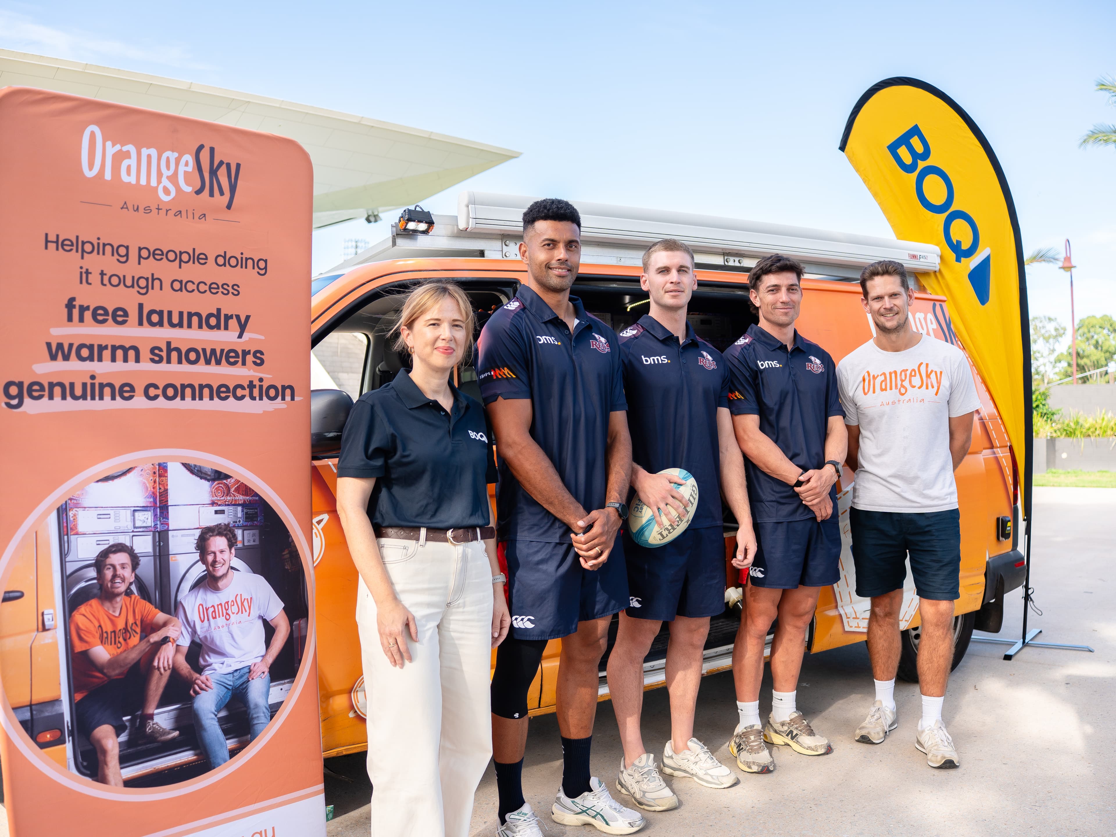 BOQ's Laura Churchill and Orange Sky's Lucas Patchett flank Reds trio Ben Volavola, Will McCulloch and Jock Campbell at the Every Try For Orange Sky launch
