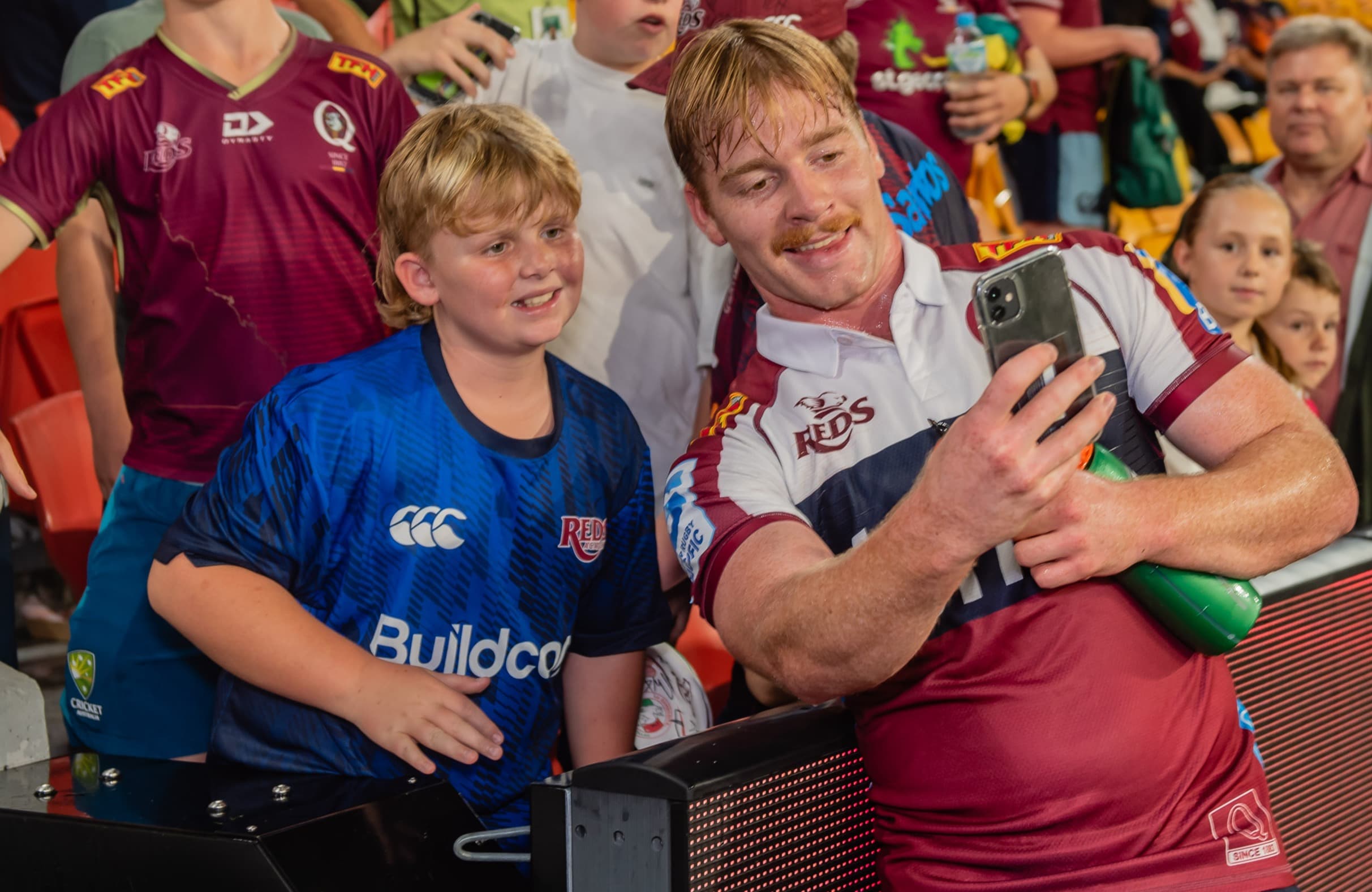 Reds fans enjoying the Suncorp Stadium experience with Harry McLaughlin-Phillips 