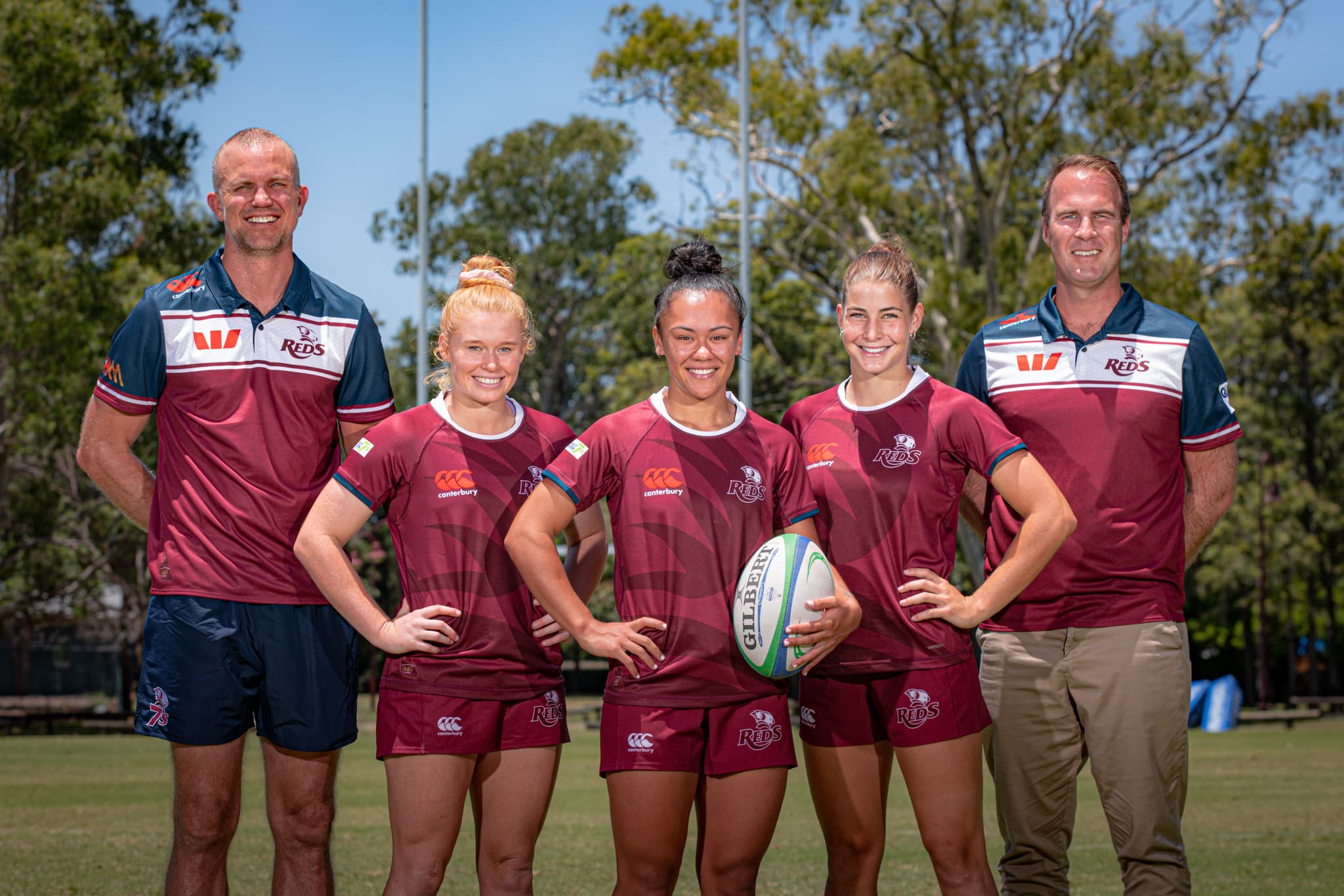 From L to R - Reds 7s head coach Reg Tayler, Reds 7s players Nat Wright, Sidney Taylor and Kaitlin Shave with QRU CEO Dave Hanham.
