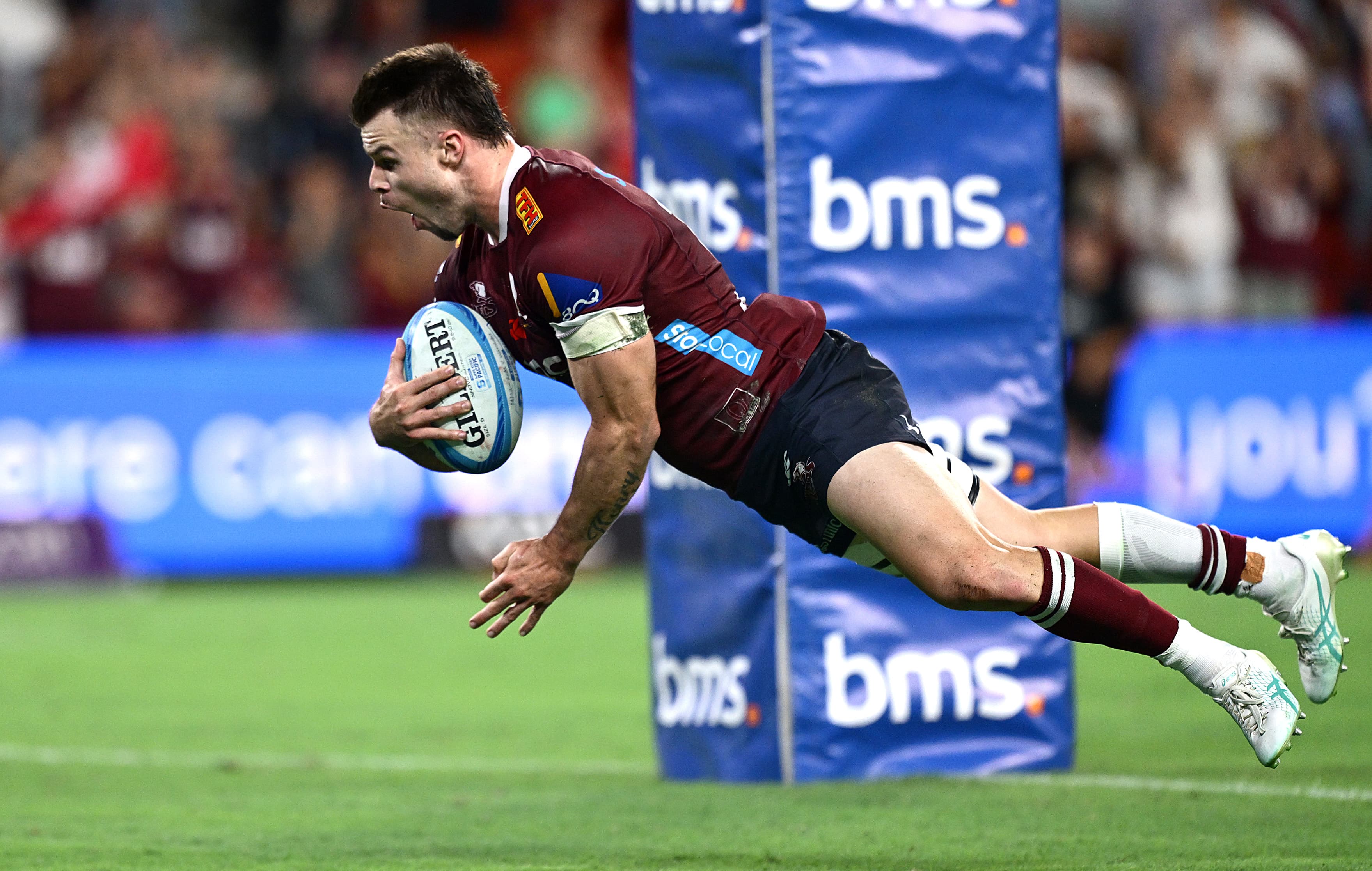 Reds centre Isaac Henry soars to score a vital try in the win over the Waratahs. Photo: Bradley Kanaris, Getty Images
