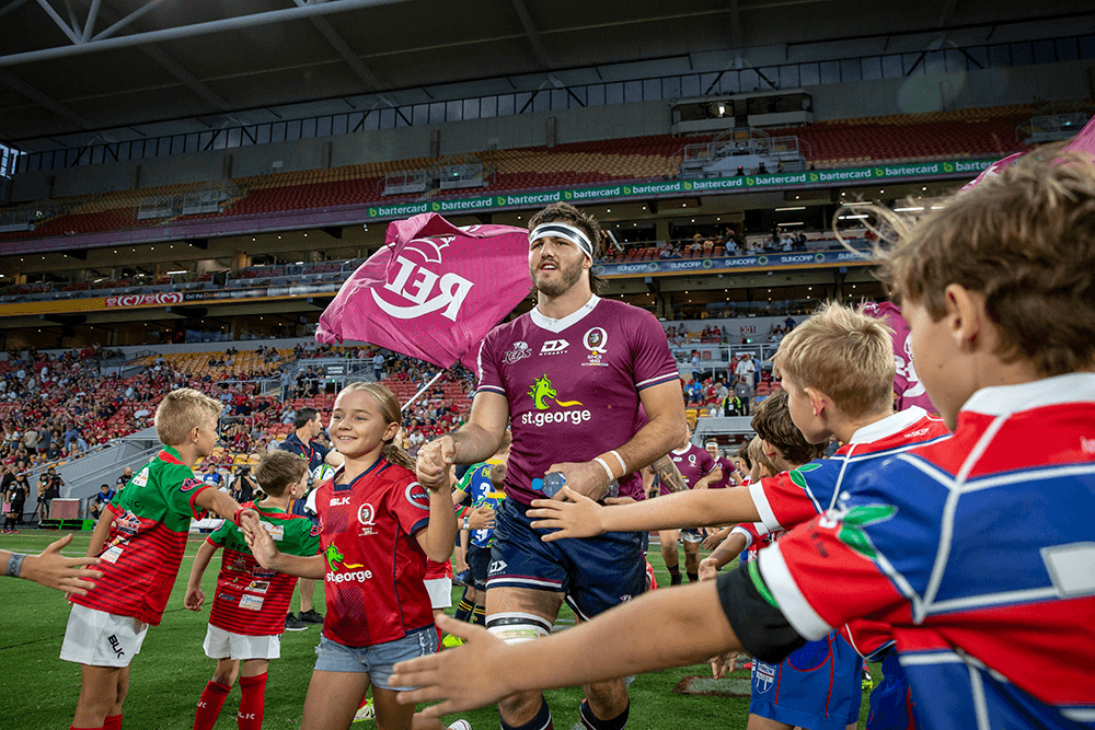 St.George Queensland Reds captain runs onto Suncorp Stadium. Photo: QRU Media/Brendan Hertel.