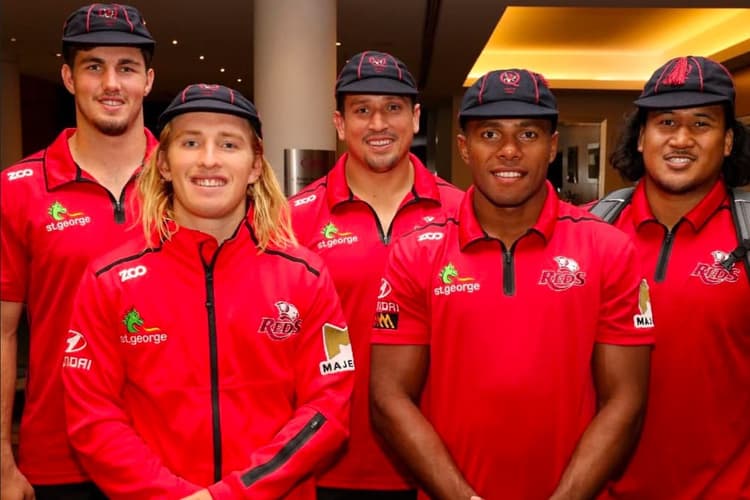 Qld Reds co-captains Liam Wright and Tate McDermott (far left, second from left) after their 2018 Super Rugby debut. Picture: QRU Media Unit