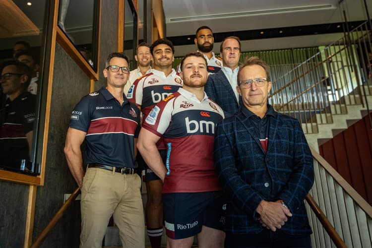 StoreLocal Chief Executive Hans Pearson (front right) and National Partnerships Manager Leigh Tovey (front left), Queensland Reds players Matt Faessler (front centre), Alex Hodgman (third from left), Lukhan Salakaia-Loto (far back), and Queensland Rugby Union chief executive David Hanham (second row, right) and QRU Head of Commercial and Content Pete Fairbairn (rear on left). 