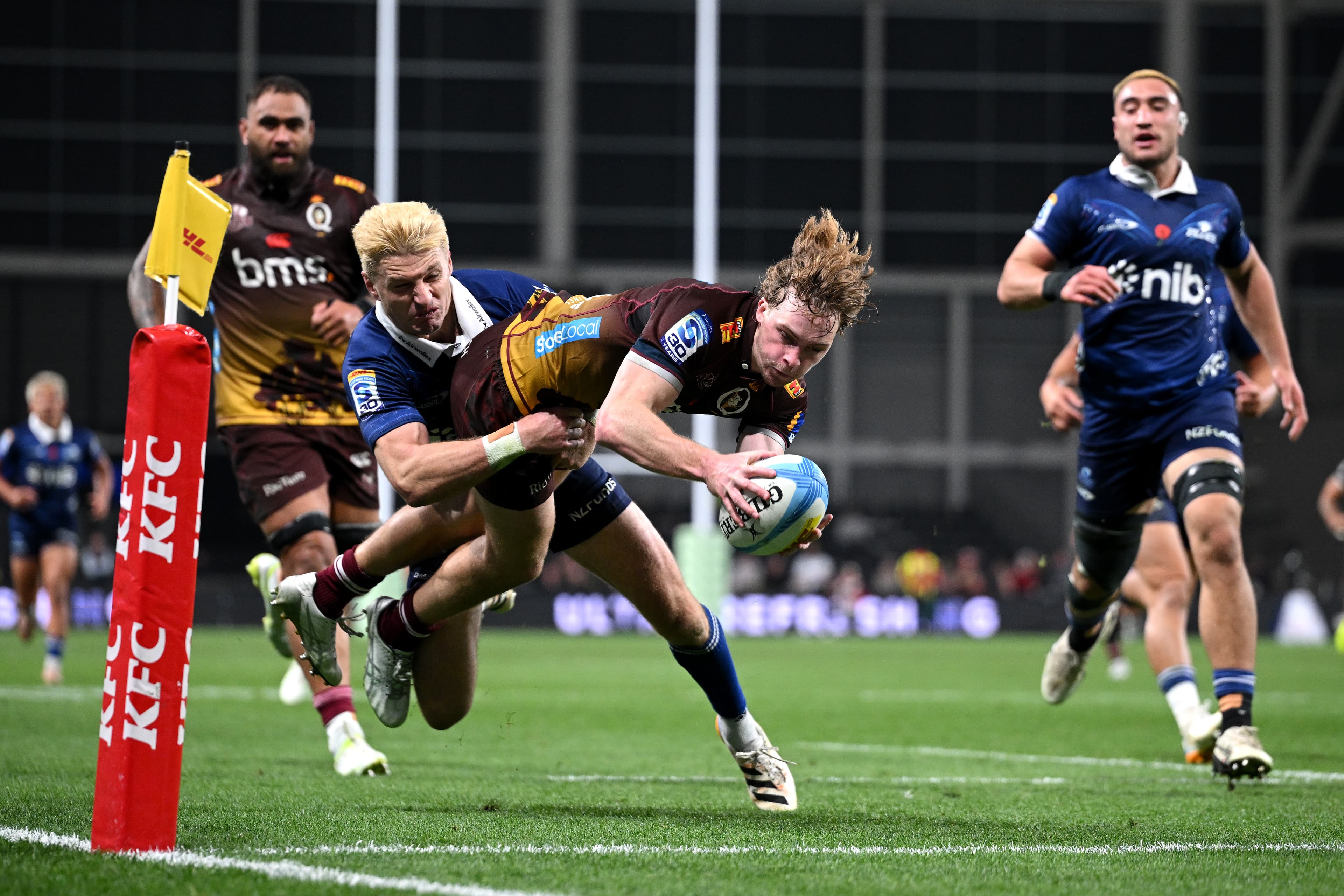 Reds winger Tim Ryan dives for a try against the Blues in Christchurch. Photo: Joe Allison, Getty Images