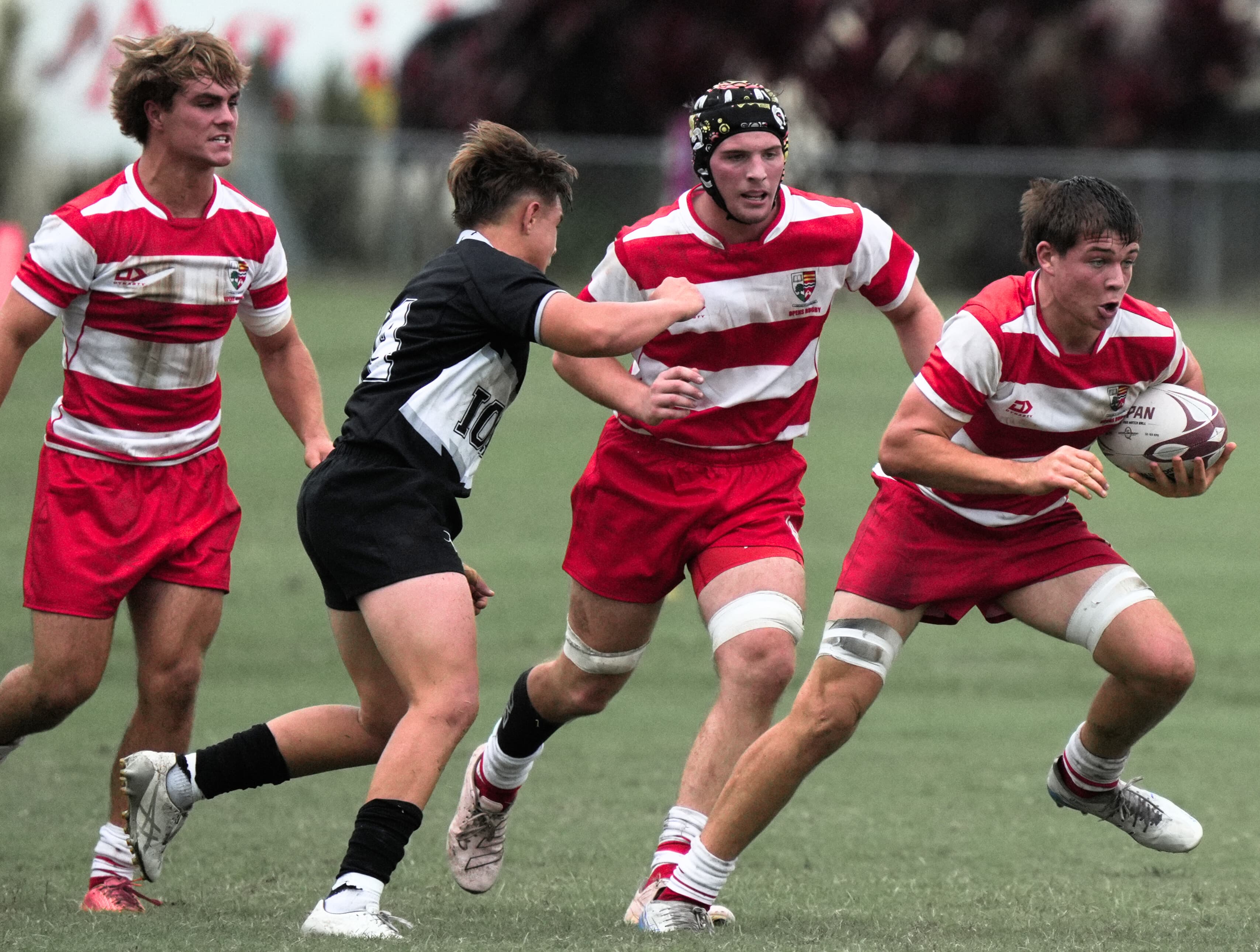 Action at last year's Ballymore Cup between U18 champions Ipswich Grammar (in red) and Iona College