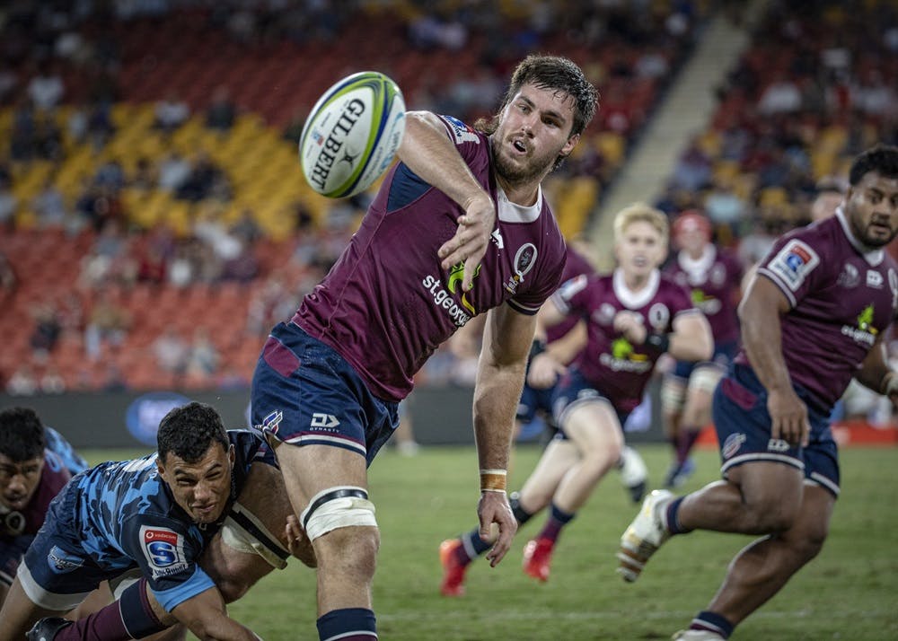 Queensland captain Liam Wright fires an offload during the Bulls match at Suncorp Stadium. Photo Credit: Brendan Hertel