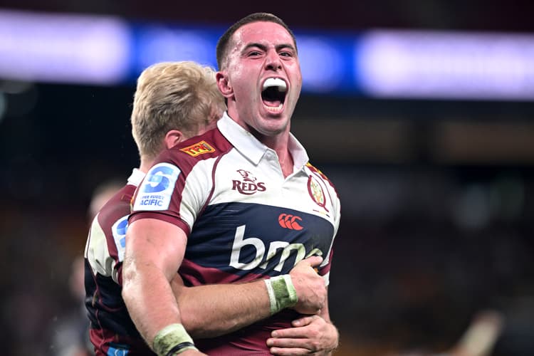 Reds backrower Joe Brial celebrates his second half try against the Hurricanes. Photo: Bradley Kanaris, Getty Images