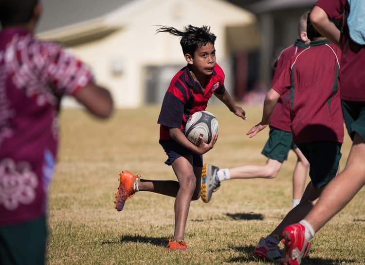 Spying a gap...a player from St Joseph's, Murgon darts away at the South Burnett Primary 7s. Photo: Neha Kumar