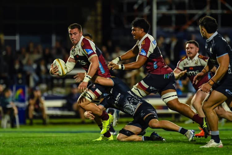 Reds backrower Joe Brial on the charge against the NSW Waratahs at the Santos Festival of Rugby. Photo: Stephen Tremain