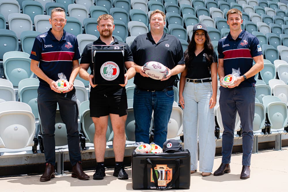 La Banderita Managing Director Stu Richardson (third from left) shares the partnership extension announcement with (from left) QRU Head of Commercial and Content Pete Fairbairn, La Banderita's Distribution & Logistics Manager Lewis Arbuthnott, La Banderita Market Development Manager Caitlin Kent and QRU Commercial Development Officer Tom Maher at Ballymore Stadium.