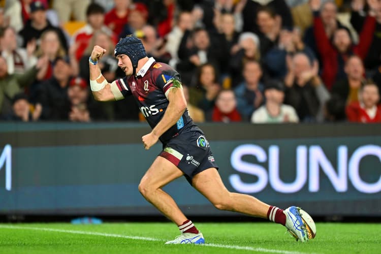 Reds centre Josh Flook celebrates his fine try against the Lions. Photo: Albert Perez, Getty Images