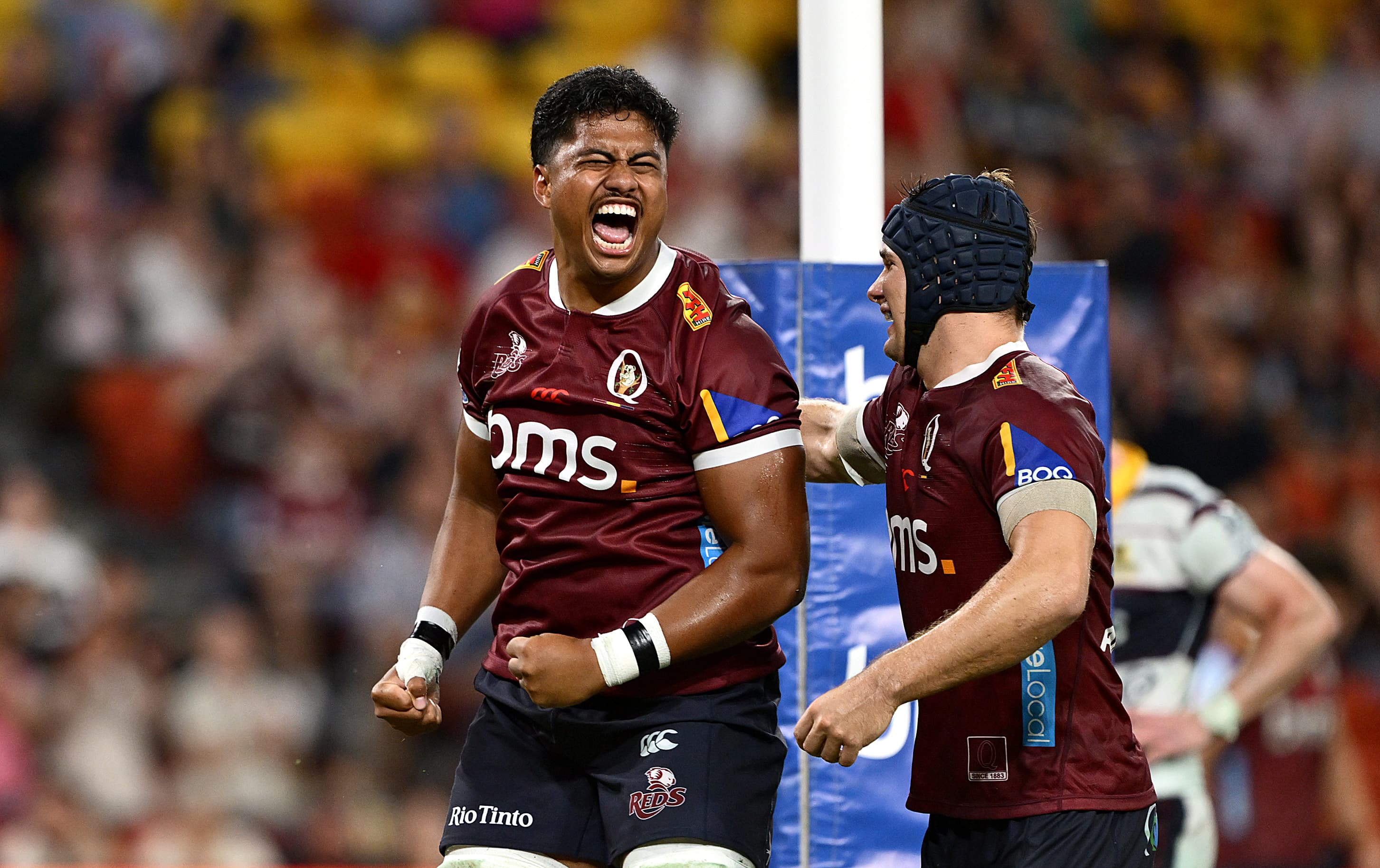 Replacement Reds No.8 Vaiuta Latu celebrates his first Super Rugby try against the Highlanders. Photo: Bradley Kanaris, Getty Images