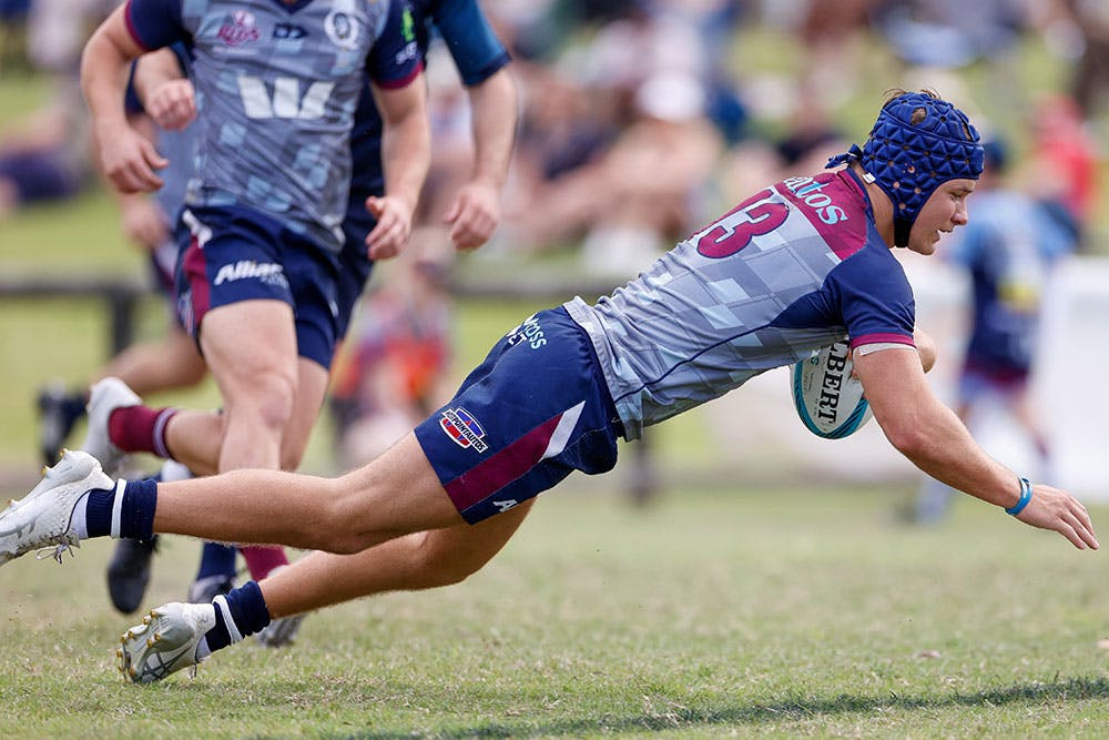 Josh Flook crashes over for the Reds Development XV at Norths Rugby Club. Photo: Kev Nagle