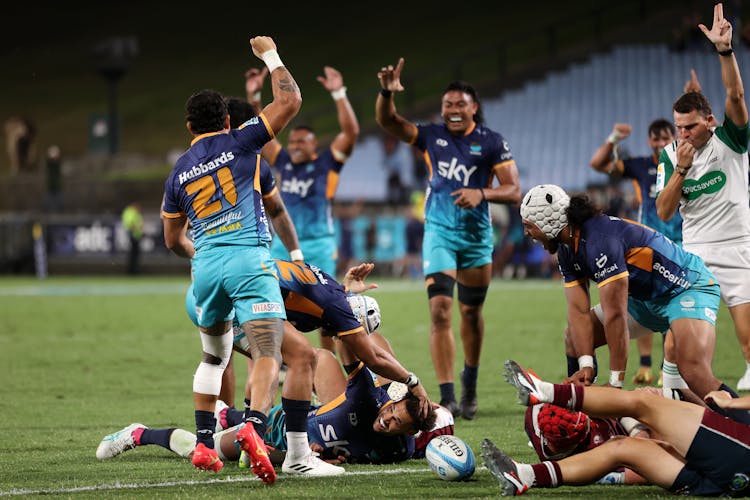 Moana Pasifika celebrate the win over the Reds. Photo: Getty Images