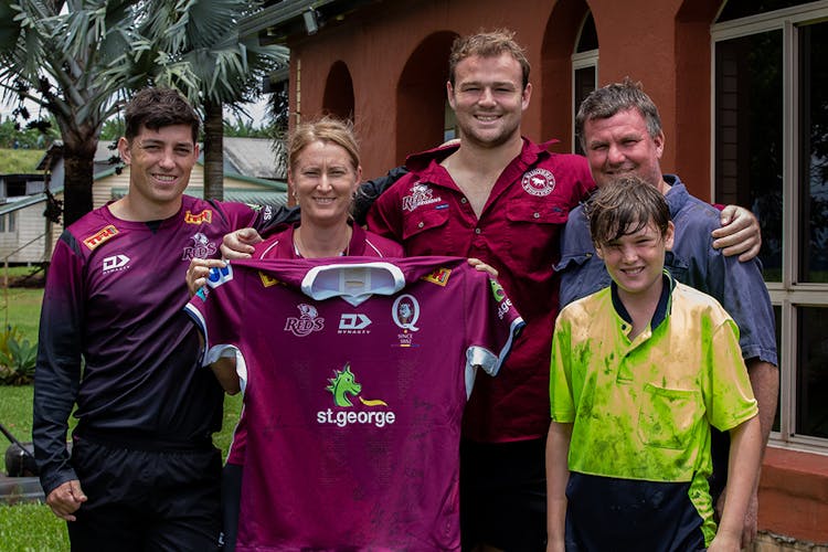 Jock Campbell and Harry Wilson with their billet family in Innisfail. Photo: QRU/Tom Mitchell
